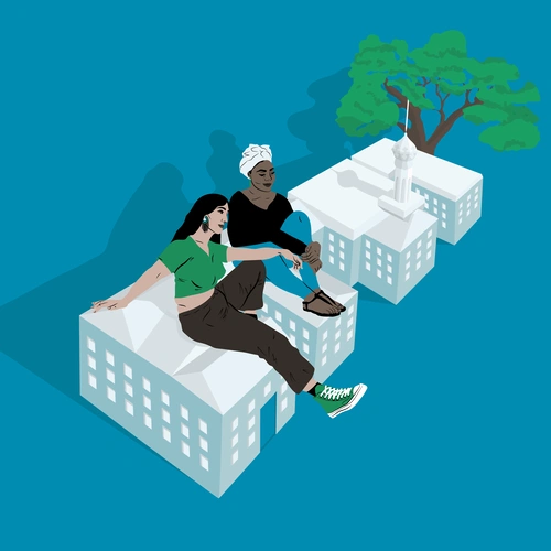 Two women sitting on the roof of a building