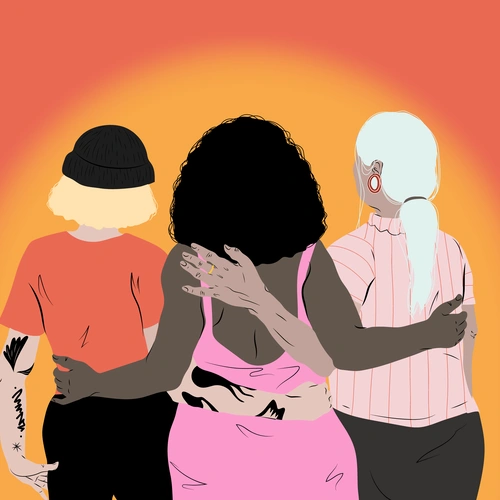 Three women hugging from behind